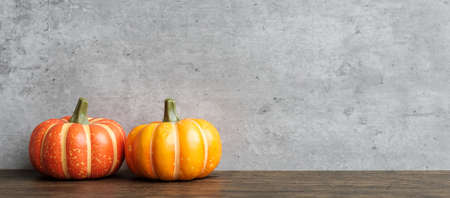 Orange pumpkin on table with copy space for banner background. Happy Halloween day, Hello October, fall autumn season, Festive, party and holiday conceptの写真素材