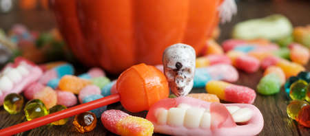 Happy Halloween day with ghost candies, pumpkin bowl, Jack O lantern and decorative (selective focus). Trick or Threat, Hello October, fall autumn, Festive, party and holiday conceptの写真素材