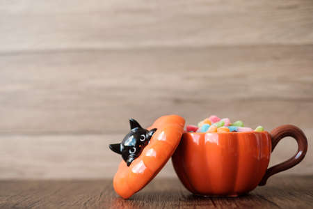 Happy Halloween day with pumpkin bowl of candies and decorative. Trick or Threat, Hello October, fall autumn, Festive, party and holiday conceptの写真素材