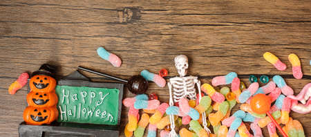 Happy Halloween day with ghost candies, pumpkin,  bowl and decorative. Trick or Threat, Hello October, fall autumn, Festive, party and holiday conceptの写真素材