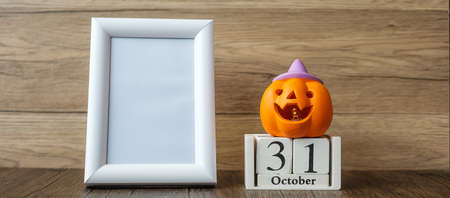 Orange pumpkin, 31 October calendar and frame with copy space for text. Happy Halloween day, Hello October, fall autumn season, Festive, party and holiday conceptの写真素材