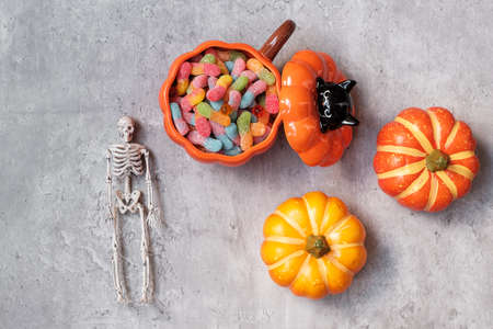 Happy Halloween day with ghost candies, pumpkin,  bowl and decorative. Trick or Threat, Hello October, fall autumn, Festive, party and holiday conceptの写真素材