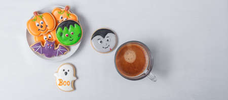 hot espresso coffee  or chocolate cup with funny Halloween Cookies. Happy Halloween day, Trick or Threat, Hello October, fall autumn, Traditional, party and holiday conceptの写真素材
