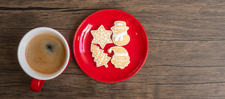 Merry Christmas with homemade cookies and coffee cup on wood table background. Xmas eve, party, holiday and happy New Year conceptの写真素材