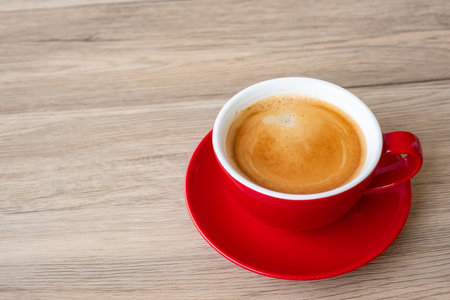 Hot espresso coffee on table, Red coffee cup in cafe or home.Top view with blank copy space for your text.の写真素材