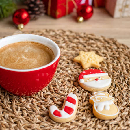 Merry Christmas with homemade cookies and coffee cup on wood table background. Xmas eve, party, holiday and happy New Year conceptの写真素材