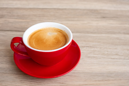 Hot espresso coffee on table, Red coffee cup in cafe or home.Top view with blank copy space for your text.の写真素材