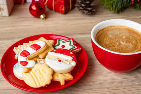 Merry Christmas with homemade cookies and coffee cup on wood table background. Xmas eve, party, holiday and happy New Year conceptの写真素材