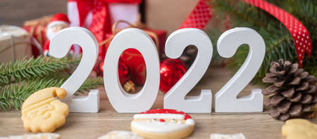 Merry Christmas and 2022 Happy New Year with decoration on table. Xmas eve, party, holiday and boxing day conceptの写真素材