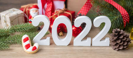 Merry Christmas and 2022 Happy New Year with decoration on table. Xmas eve, party, holiday and boxing day conceptの写真素材