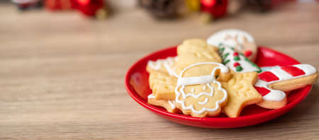 Merry Christmas with homemade cookies on wood table background. Xmas, party, holiday and happy New Year conceptの写真素材