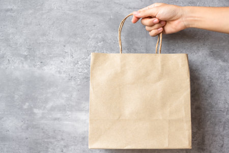 Eco friendly shopping bag on wall background. natural container. zero waste, pollution, earth day, free plastic, world Environment day conceptの写真素材