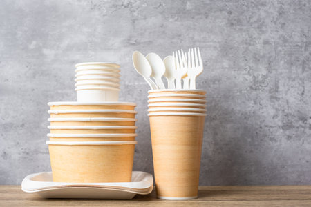 Eco friendly food packaging on table background. natural container: cup, plate, spoon and fork. zero waste, pollution, earth day, free plastic, world Environment day conceptの写真素材