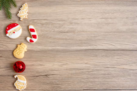 Merry Christmas with homemade cookies on wood table background. Xmas, party, holiday and happy New Year conceptの写真素材