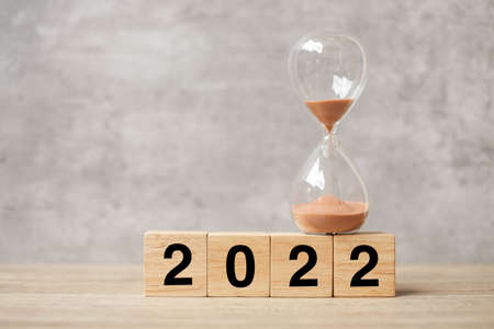 2022 text with hourglass on table. Resolution, time, plan, goal, motivation, reboot, countdown  and New Year holiday conceptsの写真素材