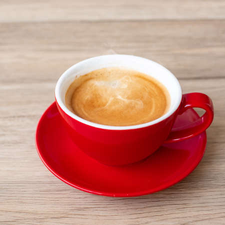 Hot espresso coffee on table, Red coffee cup in cafe or home.Top view with blank copy space for your text.の写真素材