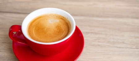 Hot espresso coffee on table, Red coffee cup in cafe or home.Top view with blank copy space for your text.の写真素材