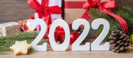 Merry Christmas and 2022 Happy New Year with decoration on table. Xmas eve, party, holiday and boxing day conceptの写真素材