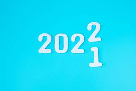 2021 change to 2022 number on blue background. Plan, finance, Resolution, strategy, solution, goal, business and New Year holiday conceptsの写真素材