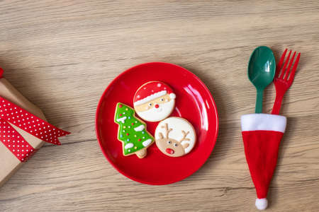 Merry Christmas with homemade cookies, fork and spoon on wood table background. Xmas, party and happy New Year conceptの写真素材