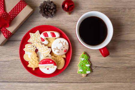 Merry Christmas with homemade cookies and coffee cup on wood table background. Xmas eve, party, holiday and happy New Year conceptの写真素材