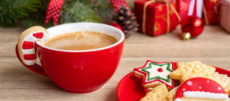 Merry Christmas with homemade cookies and coffee cup on wood table background. Xmas eve, party, holiday and happy New Year conceptの写真素材