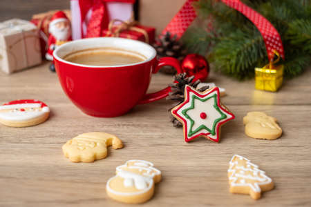 Merry Christmas with homemade cookies and coffee cup on wood table background. Xmas eve, party, holiday and happy New Year conceptの写真素材