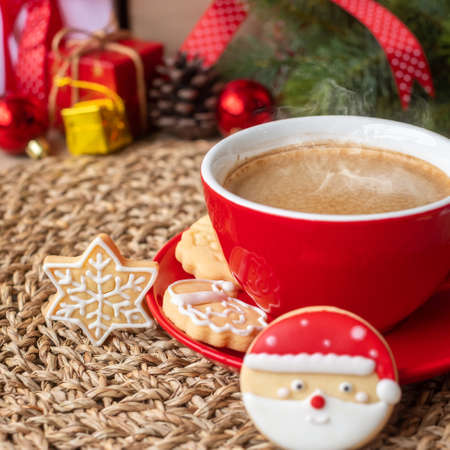 Merry Christmas with homemade cookies and coffee cup on wood table background. Xmas eve, party, holiday and happy New Year conceptの写真素材
