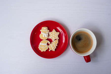 Merry Christmas with homemade cookies and coffee cup on wood table background. Xmas eve, party, holiday and happy New Year conceptの写真素材