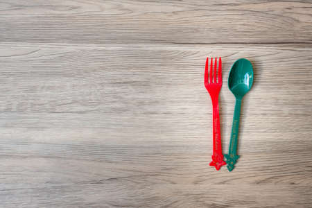 Merry Christmas with fork and spoon on wood table background. Xmas, party and happy New Year conceptの写真素材