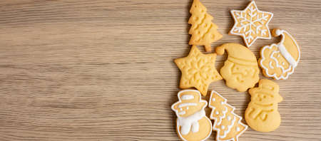 Merry Christmas with homemade cookies on wood table background. Xmas, party, holiday and happy New Year conceptの写真素材
