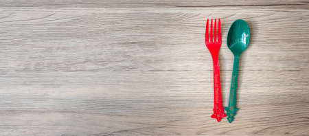 Merry Christmas with fork and spoon on wood table background. Xmas, party and happy New Year conceptの写真素材