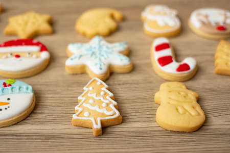 Merry Christmas with homemade cookies on wood table background. Xmas, party, holiday and happy New Year conceptの写真素材