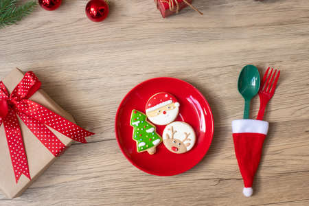 Merry Christmas with homemade cookies, fork and spoon on wood table background. Xmas, party and happy New Year conceptの写真素材