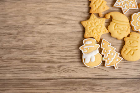 Merry Christmas with homemade cookies on wood table background. Xmas, party, holiday and happy New Year conceptの写真素材