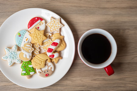 Merry Christmas with homemade cookies and coffee cup on wood table background. Xmas eve, party, holiday and happy New Year conceptの写真素材