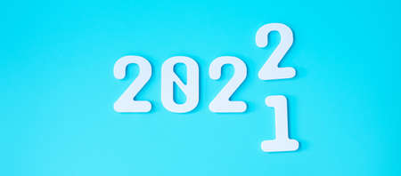2021 change to 2022 number on blue background. Plan, finance, Resolution, strategy, solution, goal, business and New Year holiday conceptsの写真素材