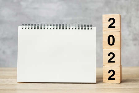 2022 Happy New Year with blank notebook and wooden number. countdown, Resolution, Goals, Plan, Action and Mission Conceptの写真素材