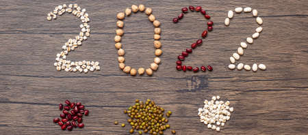 2022 New Year and New You with organic Beans; red, black, white, green, chickpeas and Adlay on table. Goals, Healthy, Motivation, Resolution, Weight loss, dieting and world food day conceptの写真素材