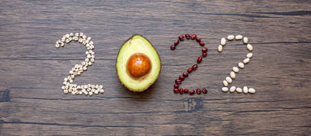 2022 Happy New Year and New You with fruit and vegetable; Avocado, adlay and Bean on table. Goals, Healthy, Motivation, Resolution, Time to New Start, dieting and world food day conceptの写真素材