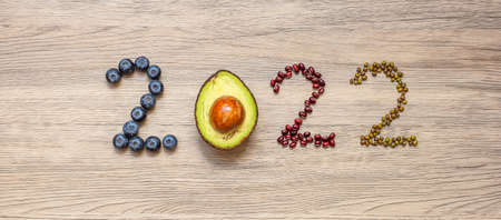 2022 Happy New Year and New You with fruit and vegetable; Blueberries, Avocado and Bean on table. Goals, Healthy, Motivation, Resolution, Time to New Start, dieting and world food day conceptの写真素材