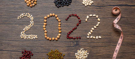 2022 New Year with organic Beans; red, black, white, green, chickpeas and Adlay on table. Goals, Healthy, Motivation, Resolution, Weight loss, dieting and world food day conceptの写真素材