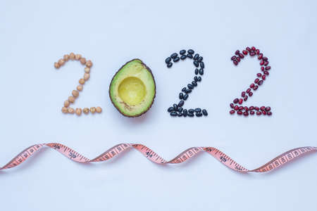2022 Happy New Year and New You with fruit and vegetable; Avocado, adlay and Bean on table. Goals, Healthy, Motivation, Resolution, Time to New Start, dieting and world food day conceptの写真素材