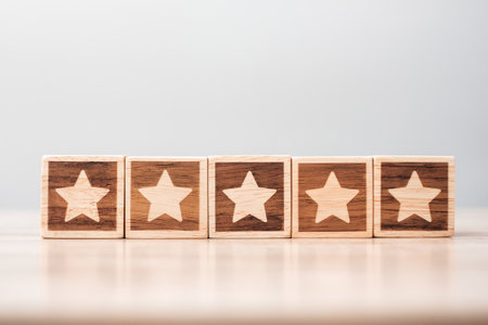 star symbol block on table background. Service rating, ranking, customer review, satisfaction, evaluation and feedback conceptの写真素材