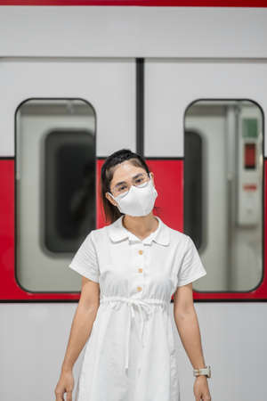 happy woman with Protective face maskの写真素材