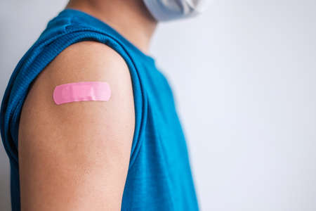 man showing bandageの写真素材