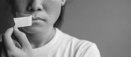 woman with mouth sealed in adhesive tape. Free of speech, freedom of press, Human rights, Protest dictatorship, democracy, liberty, equality and fraternity conceptsの写真素材