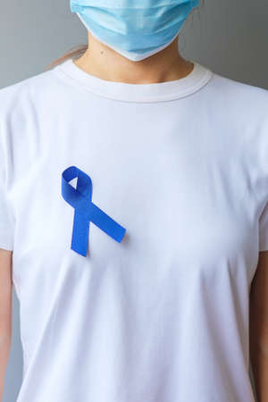 March Colorectal Cancer Awareness month,  dark Blue Ribbon for supporting people living and illness. Healthcare, hope and World cancer day conceptの写真素材