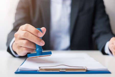 Businessman stamp during signing contract document.Business contract, approve, partnership, contract...