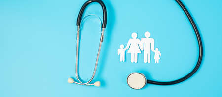 Happy Family day. Stethoscope and paper shape cutout with Father, Mother, and Children. international day of families, Health, wellness, Life and Insurance concepts.の写真素材
